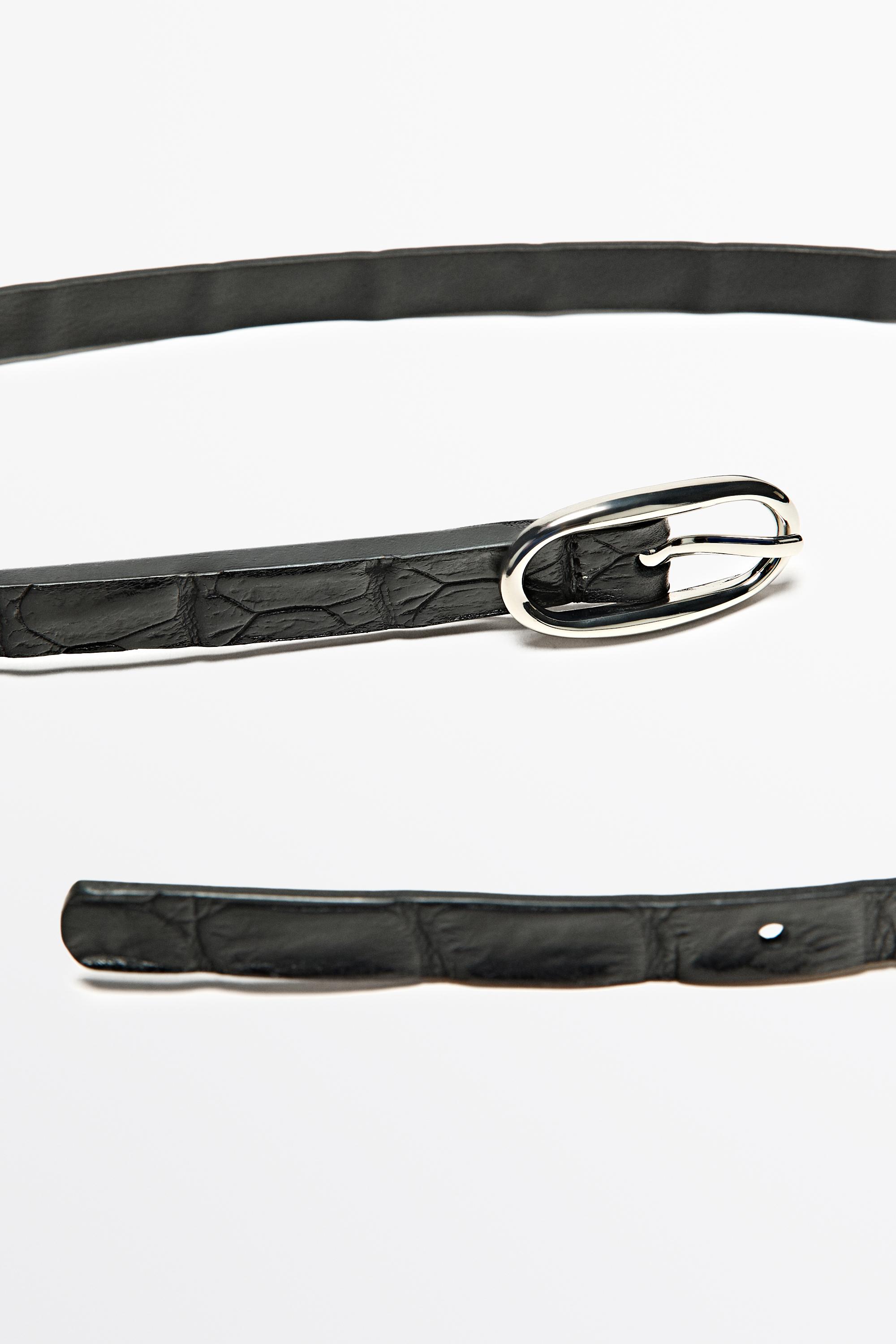 Leather belt with oval buckle and textured finish