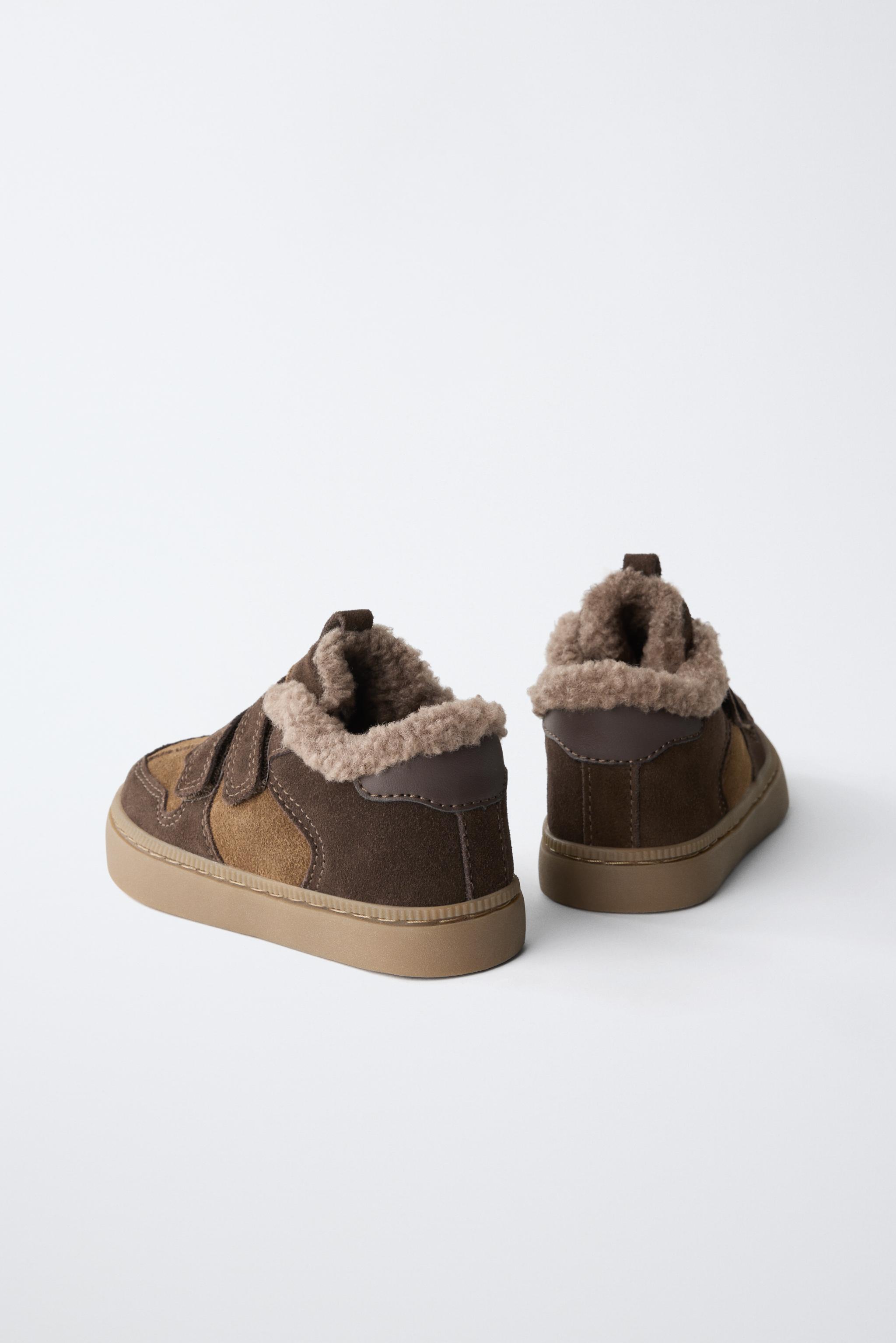 BASKETS MONTANTES EN CUIR