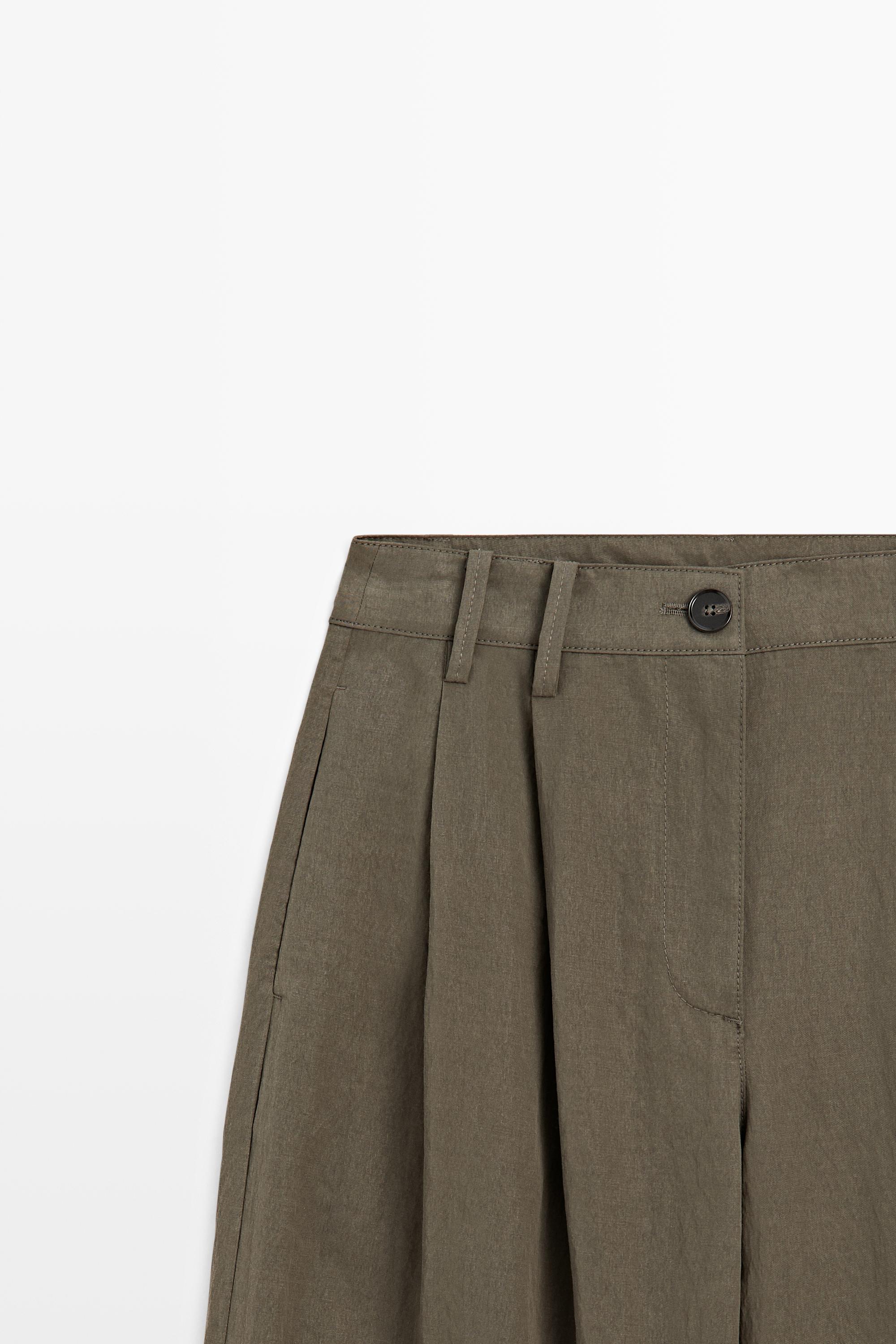 Technical wide-leg pleated pants — Black gold