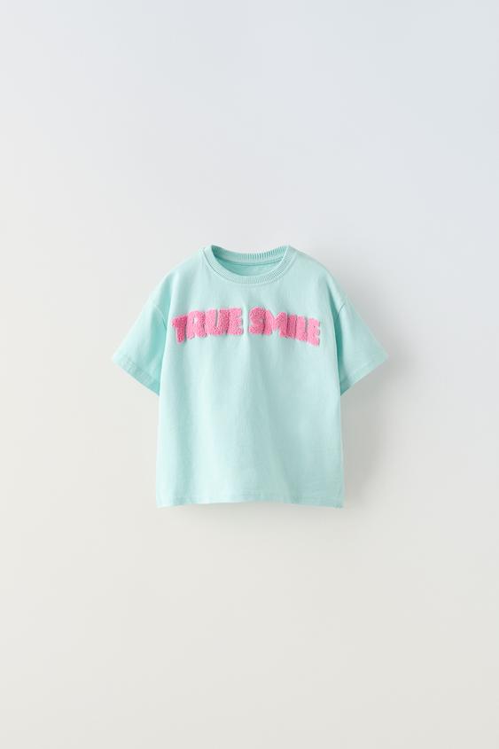 Camiseta Negra flores rosas/azul bebé F1048 (YF30)