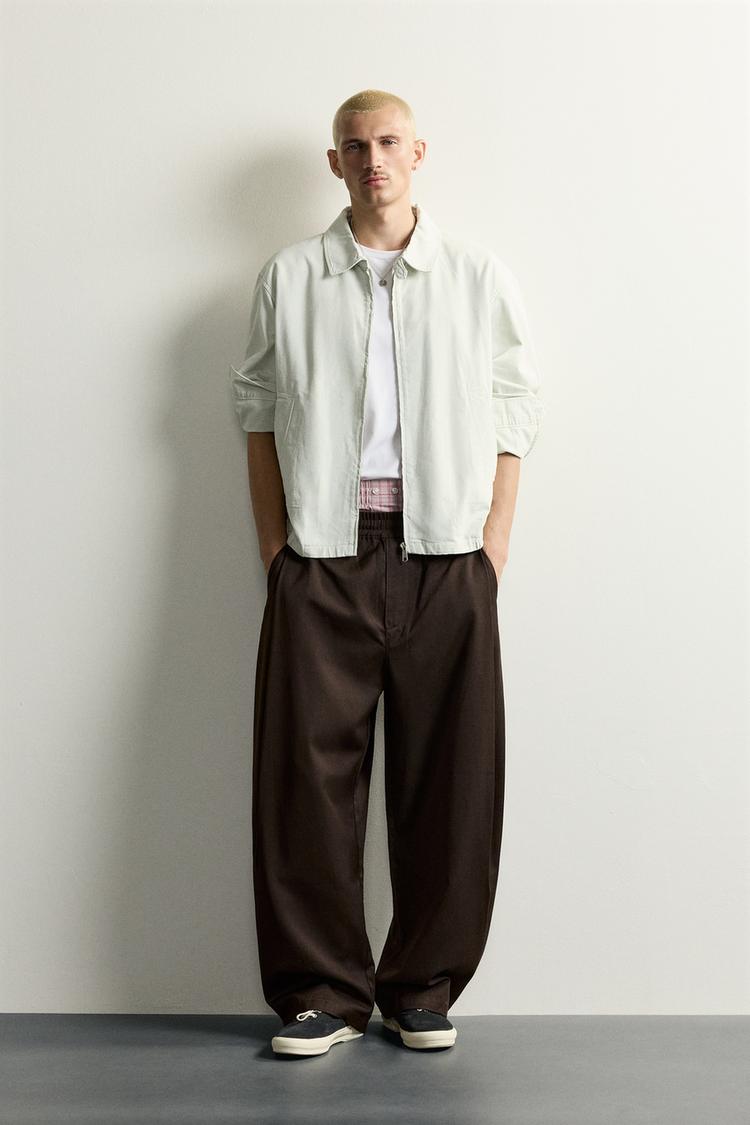 BALLOON FIT TROUSERS WITH SIDE PLEATS