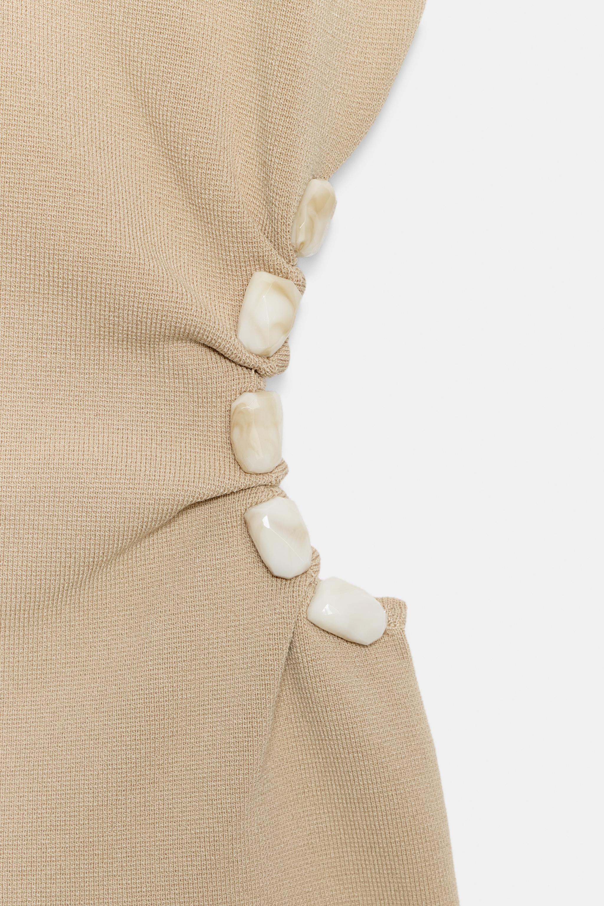 CUT OUT BEADED KNIT TOP