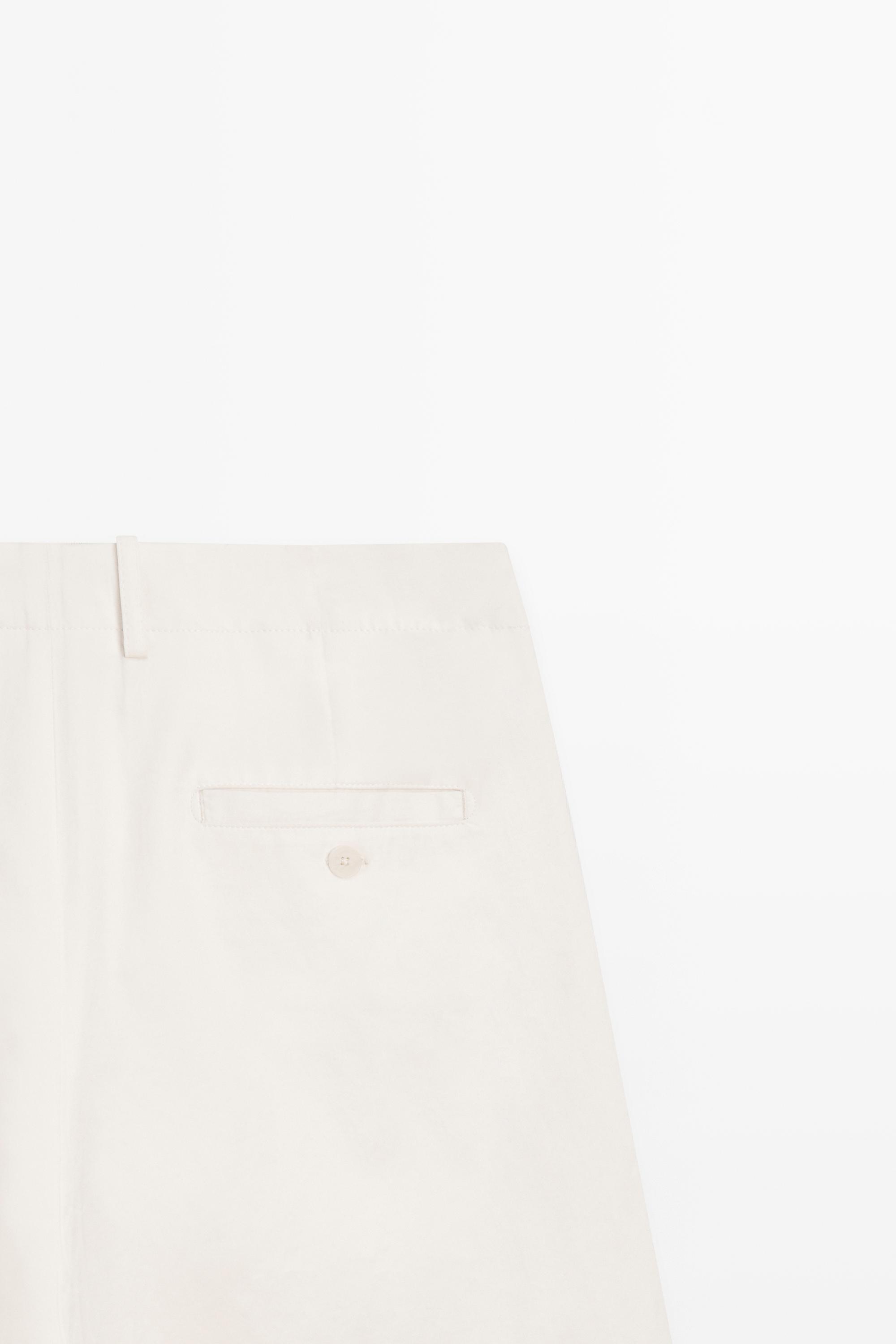 Pleated trousers with crossover fastening - STUDIO