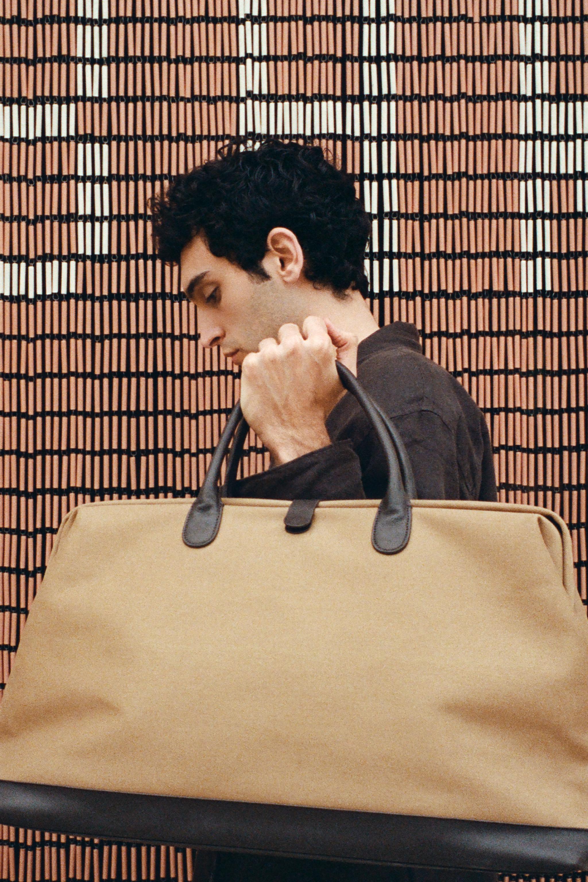 COTTON TRAVEL BAG WITH BUTTON CLOSURE