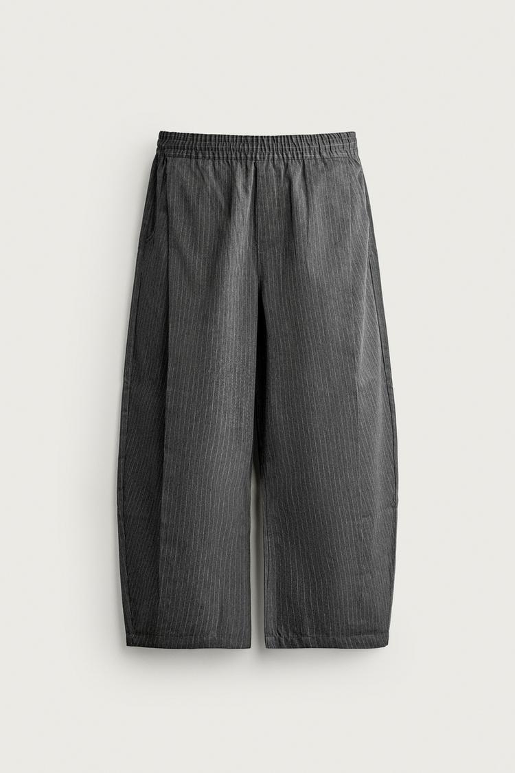BALLOON FIT TROUSERS WITH SIDE PLEATS