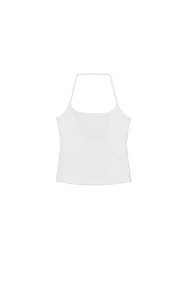 Front view of a fitted, sleeveless white top with a halter neck and round neckline.
