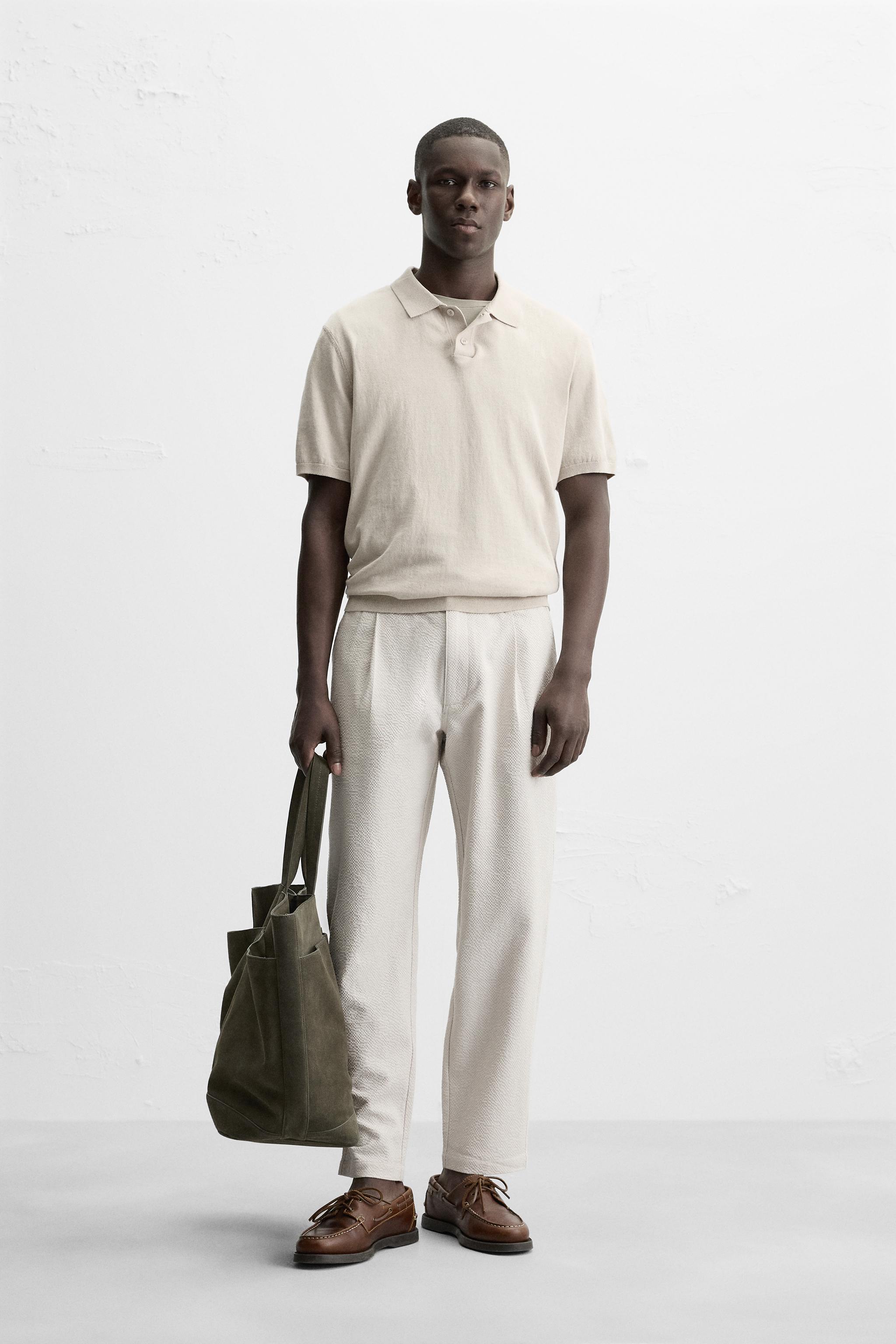 TEXTURED PLEATED TROUSERS