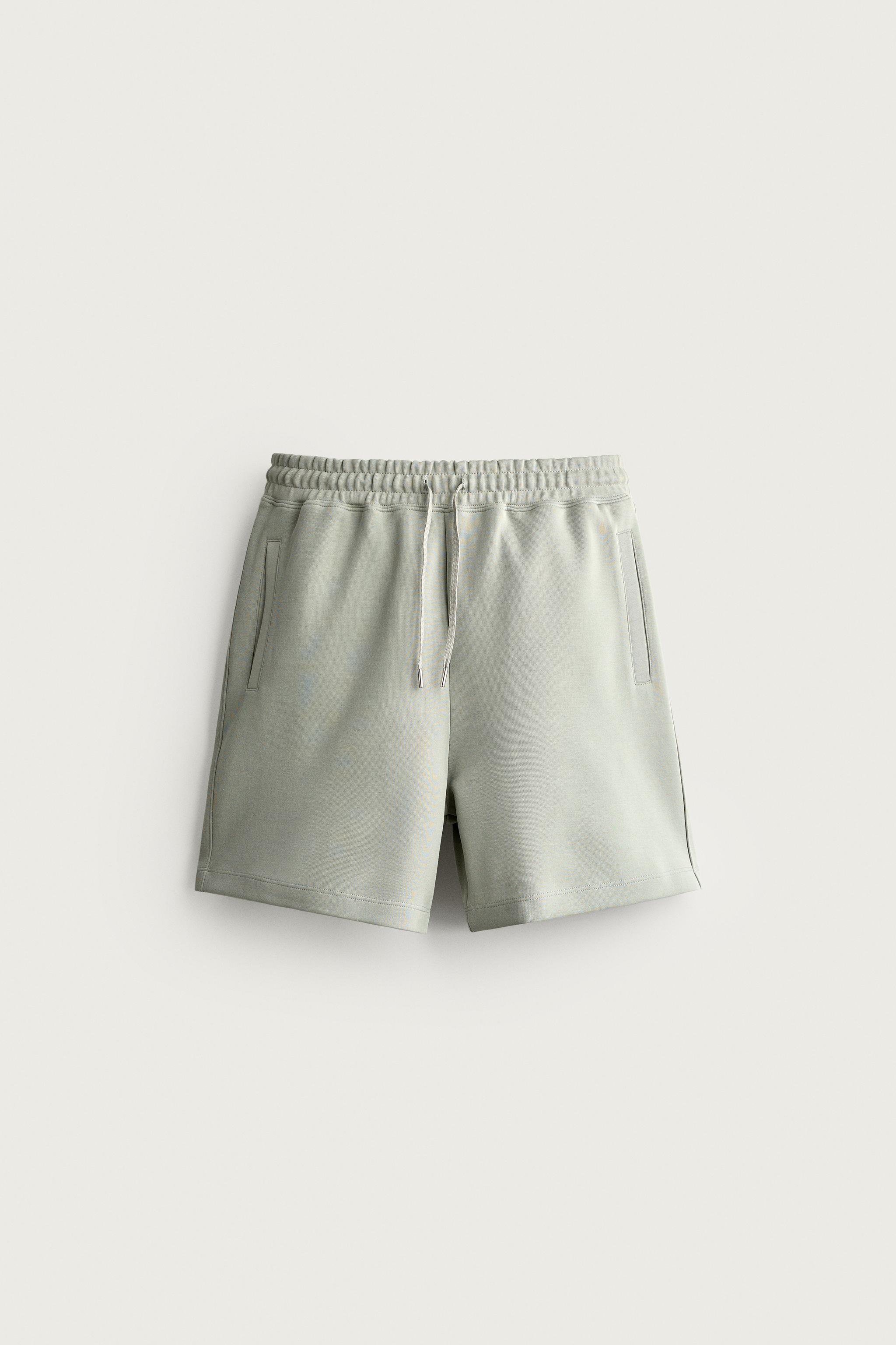 RELAXED FIT INTERLOCK TRACK SHORTS — Washed green