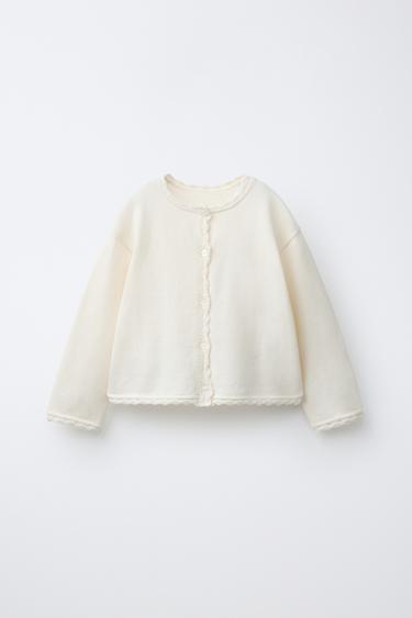 GILET EN MAILLE DÉTAILS DÉMAILLÉS - Écru de Zara