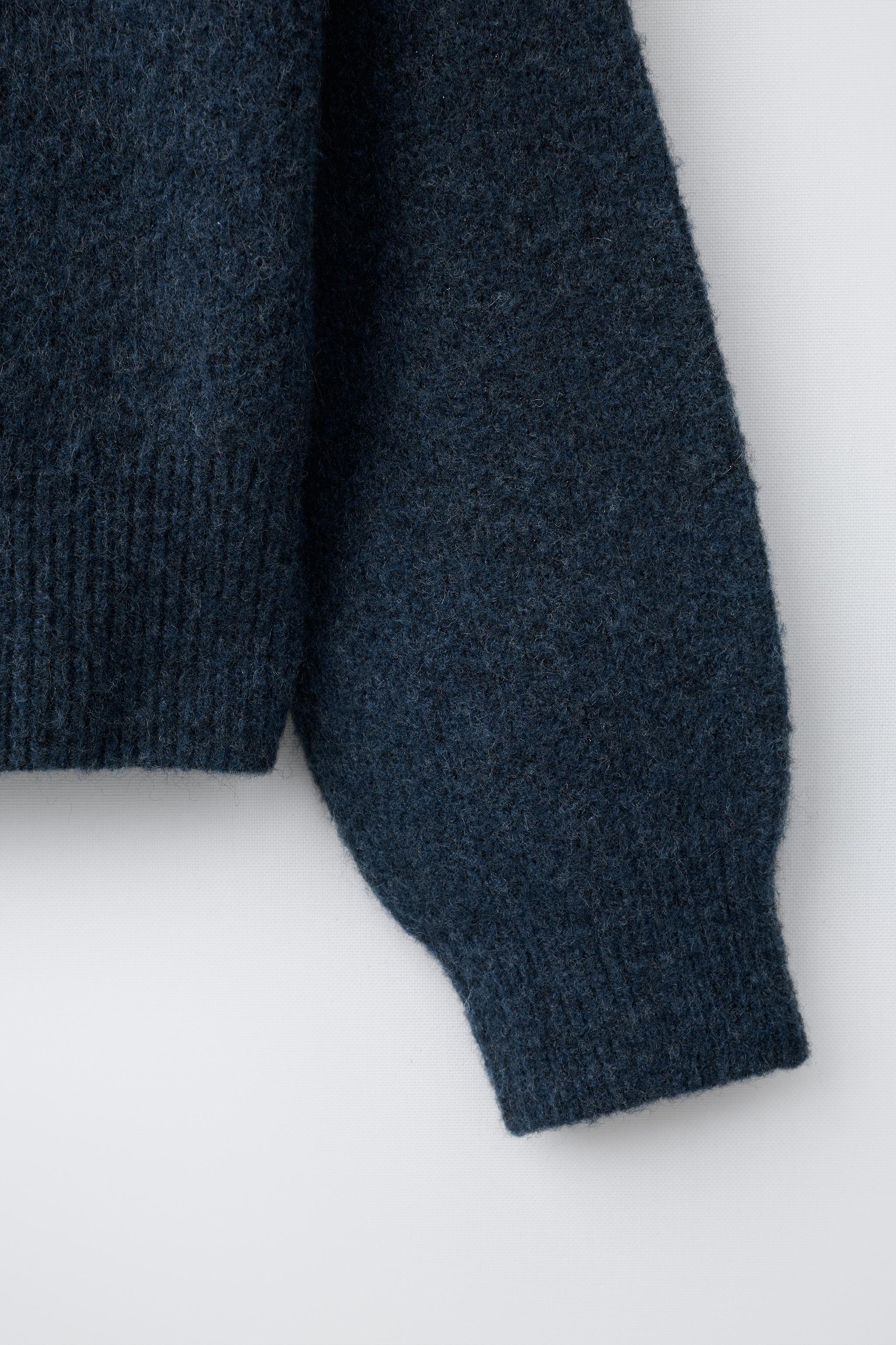 PULL EN MAILLE ÉTOILE CLOUS