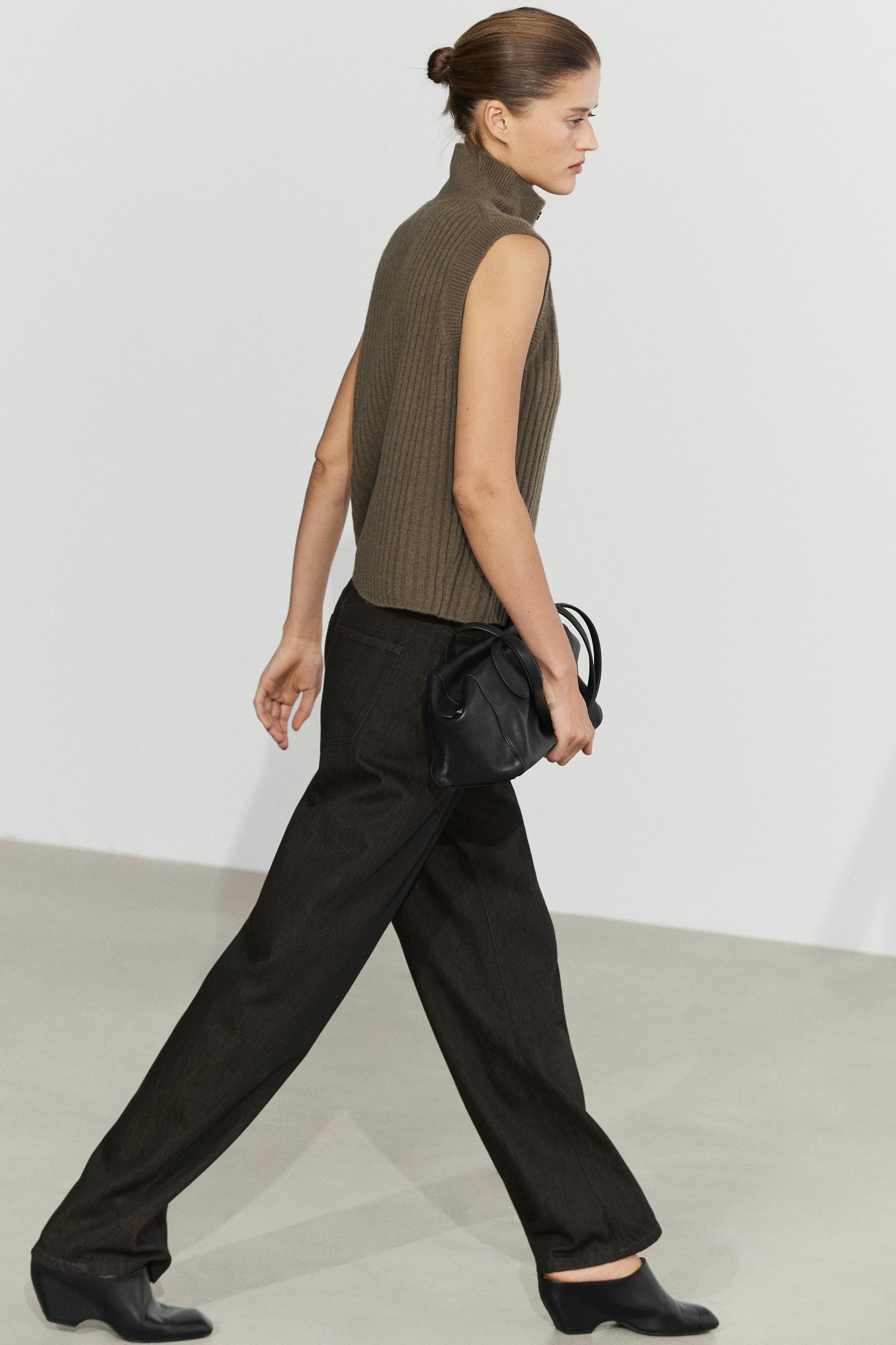 Knit vest with buttoned high neck