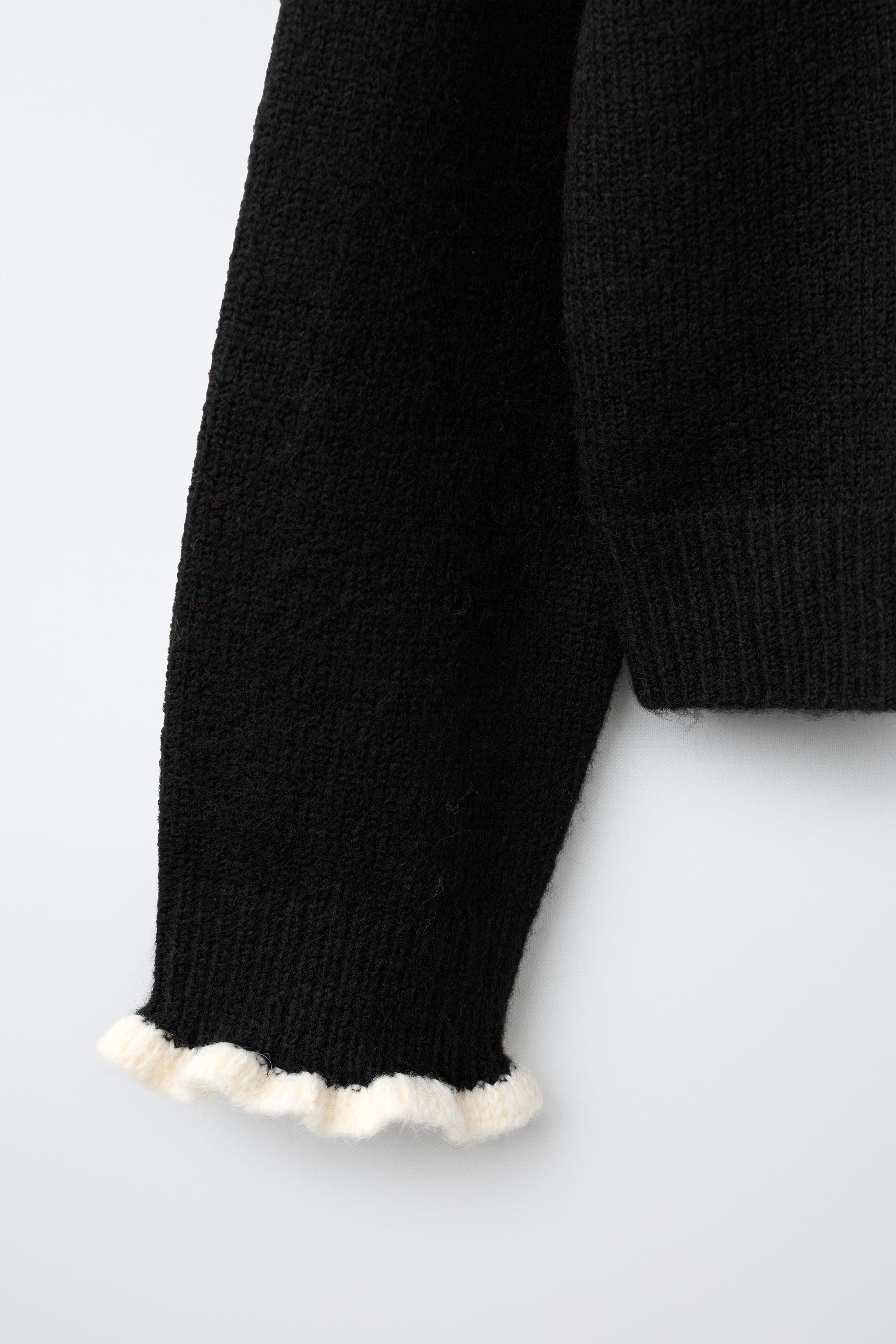 GILET EN MAILLE À VOLANTS CONTRASTANTS