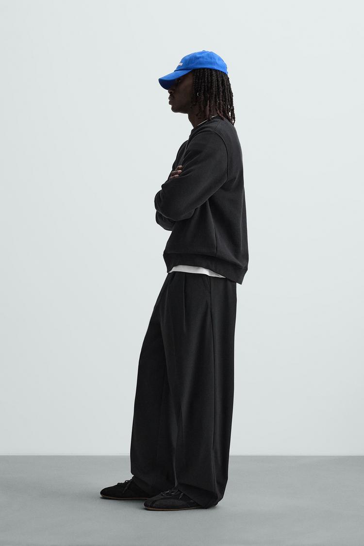 WIDE FIT PLEATED TROUSERS