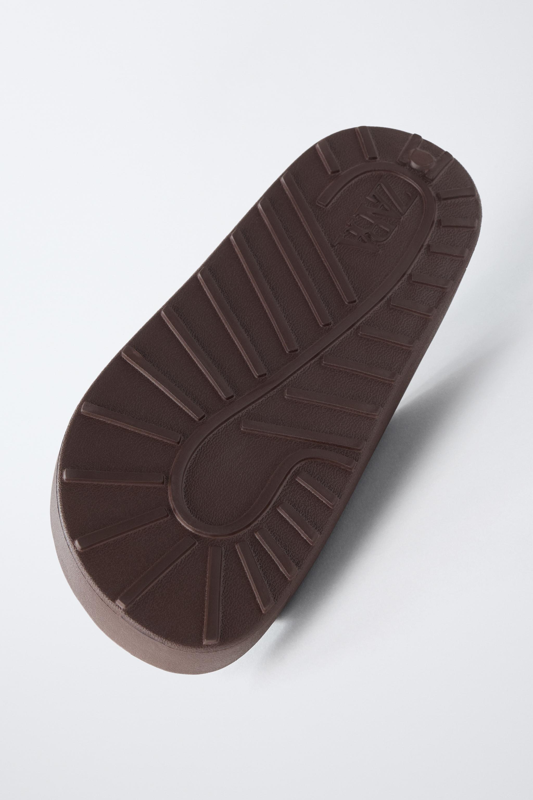 RUBBERIZED BUCKLED SANDALS