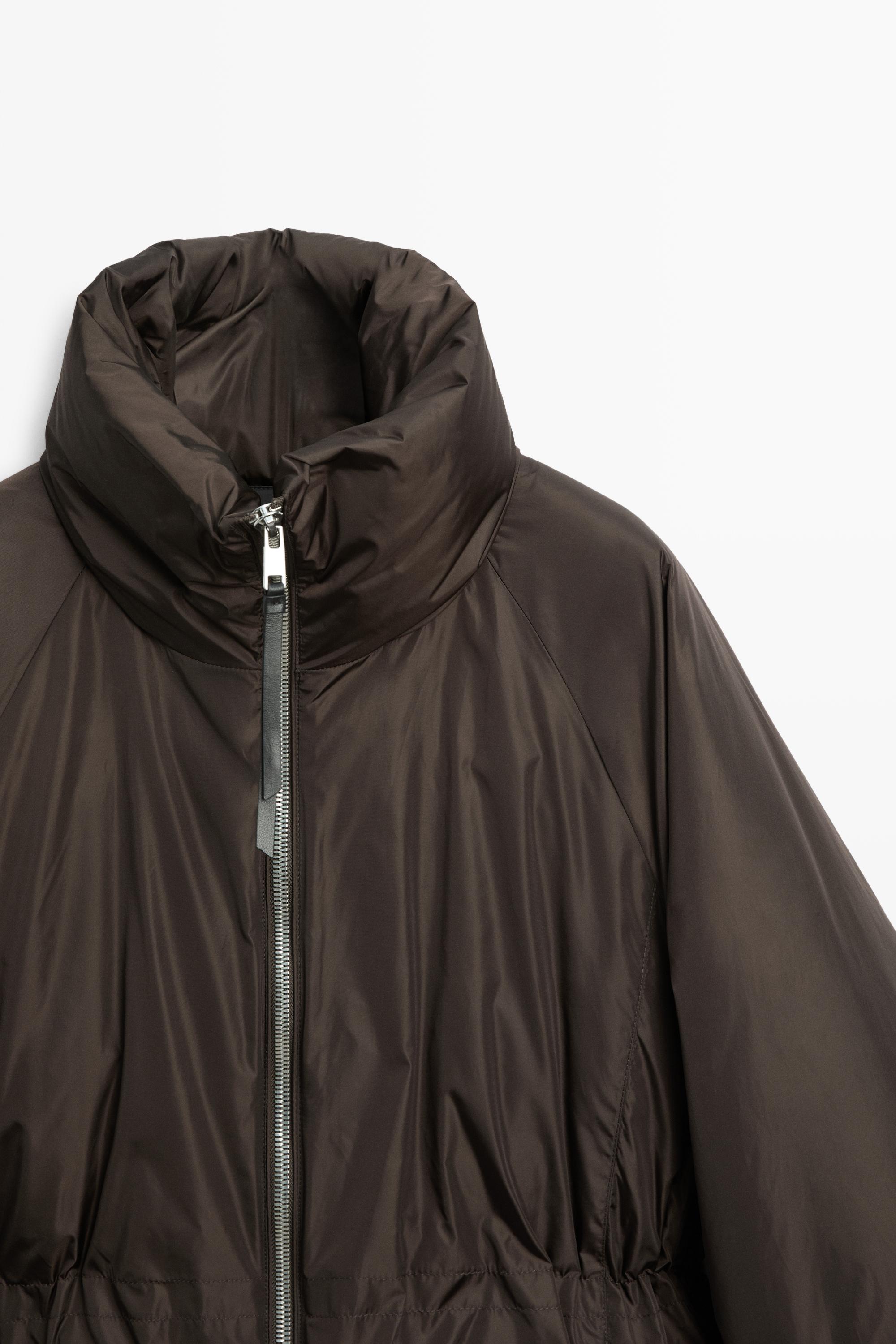 Down jacket with gathered detail