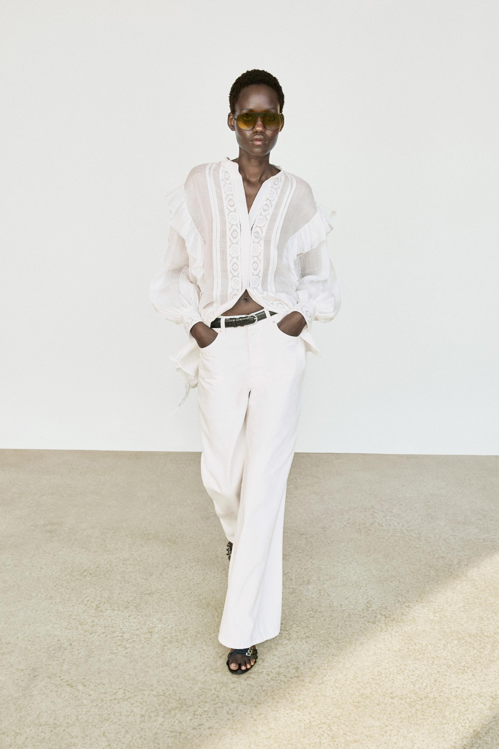 Stand collar blouse with embroidery and ruffles