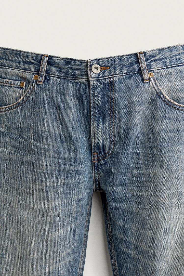 JEANS DE CINTURA BAJA CON ROTURAS Y PIERNA ACAMPANADA 8