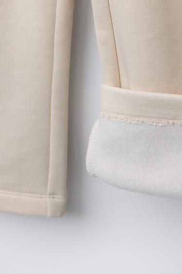PANTALON EN MOLLETON À JAMBES LARGES - Écru de Zara - Image 3
