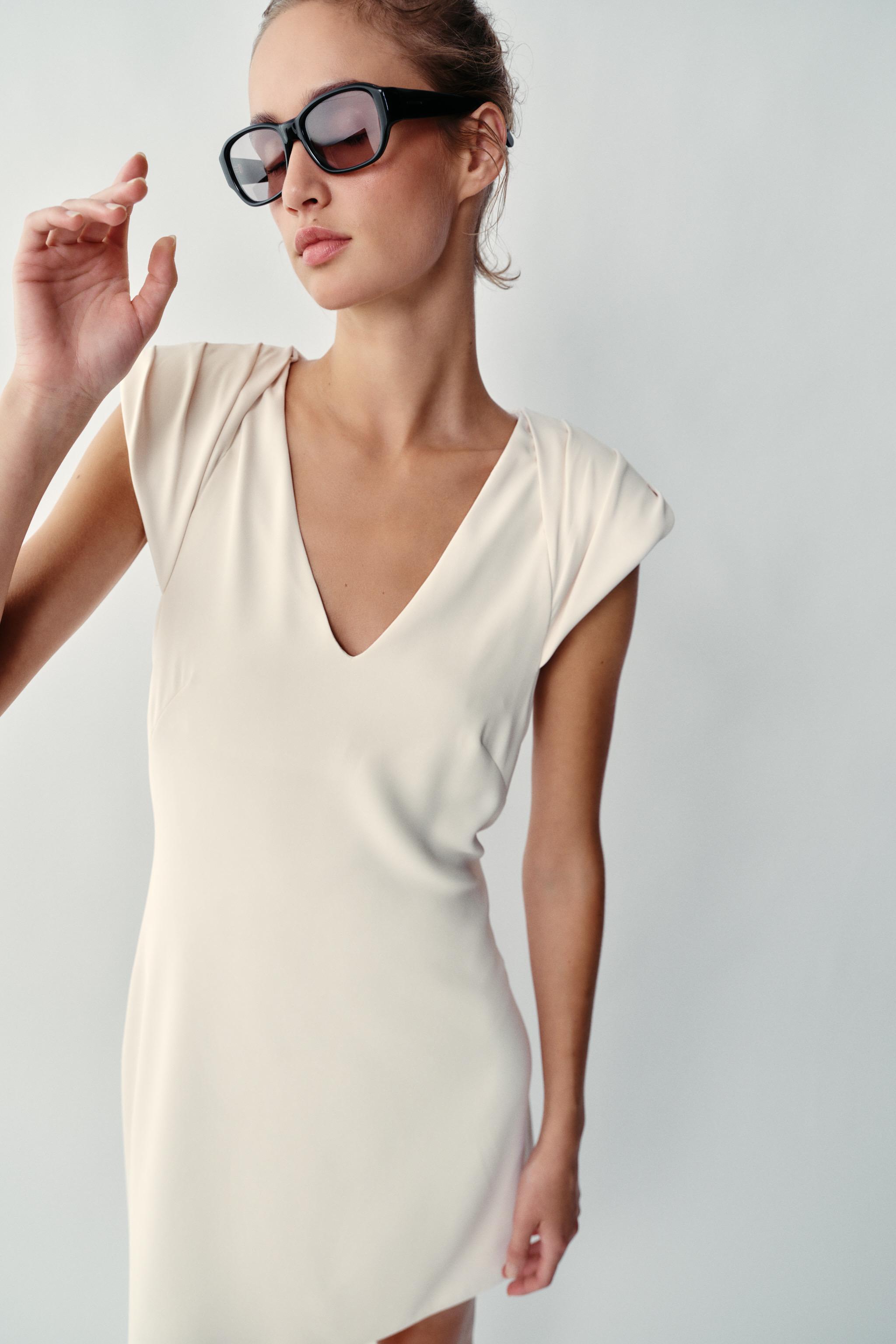 ASYMMETRIC SHORT DRESS WITH SHOULDER PADS