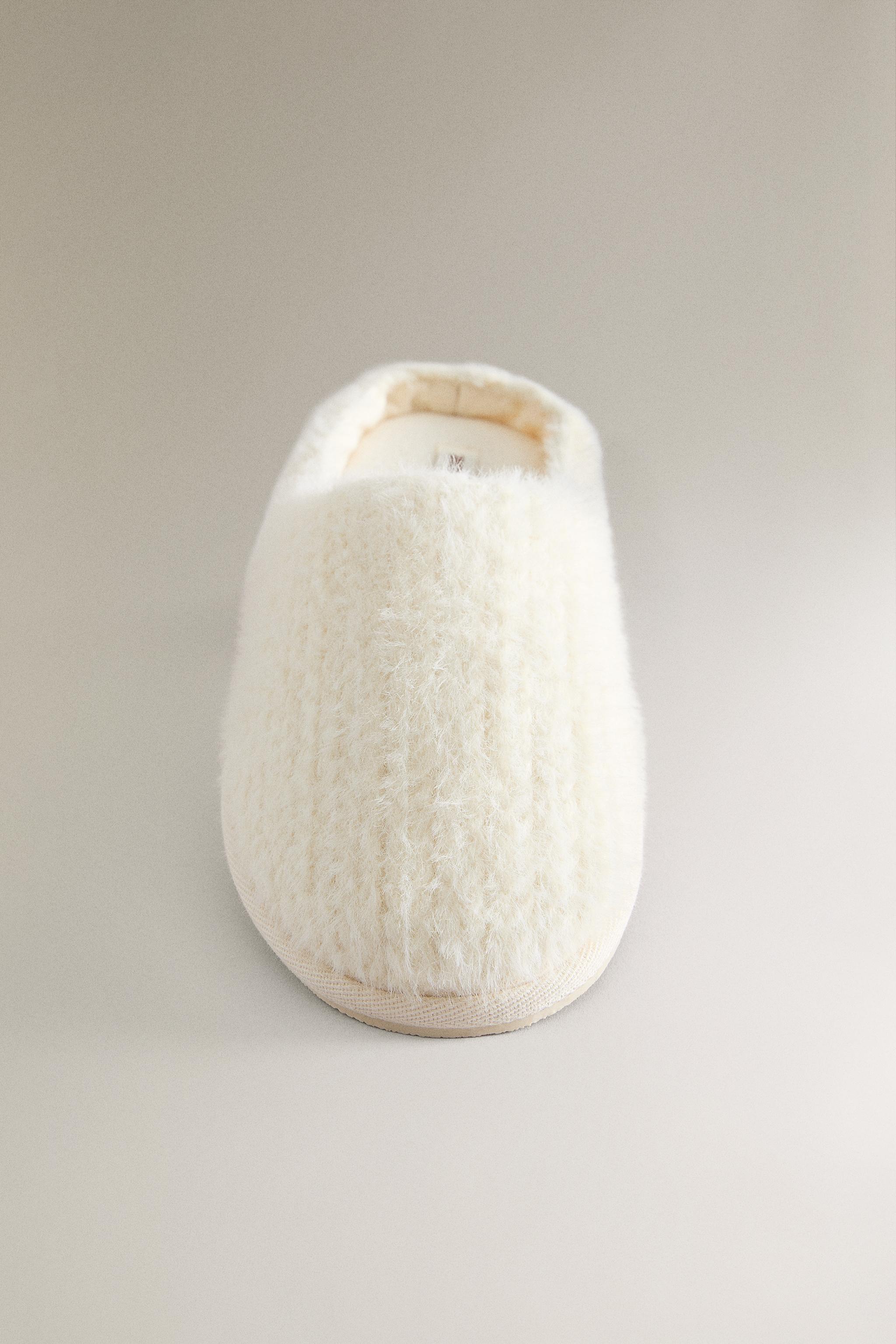 SLIPPERS WITH BRAIDED FAUX FUR DETAIL