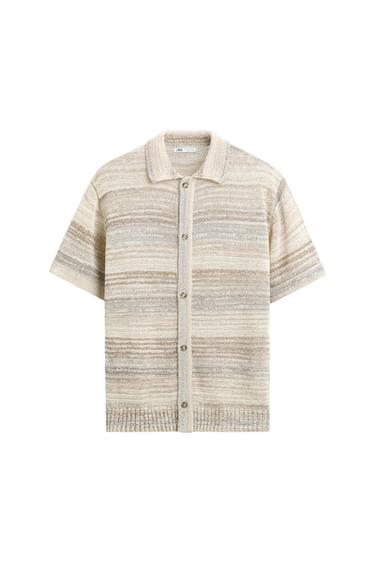 Beige knit shirt with horizontal stripes in shades of brown and gray, short sleeves, and front buttons.