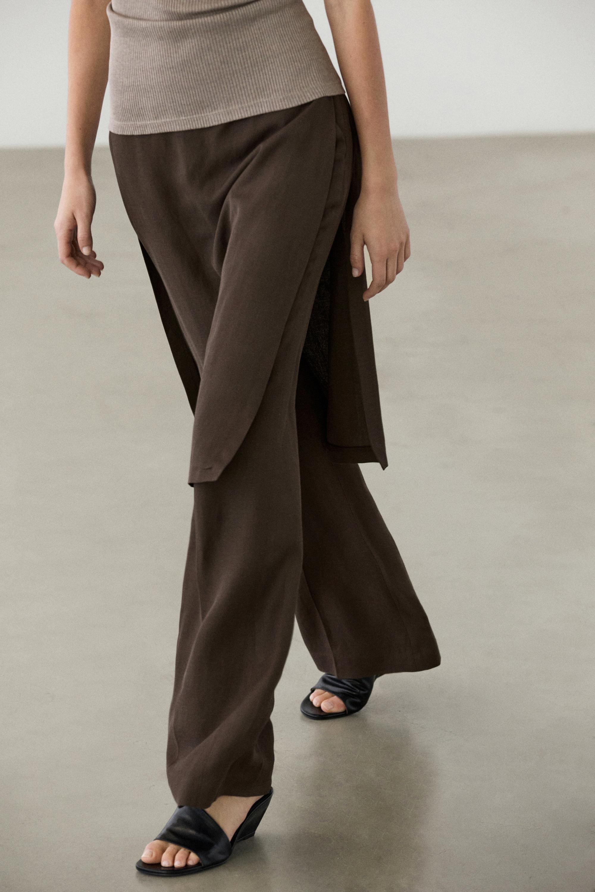 Flowing trousers with skirt detail
