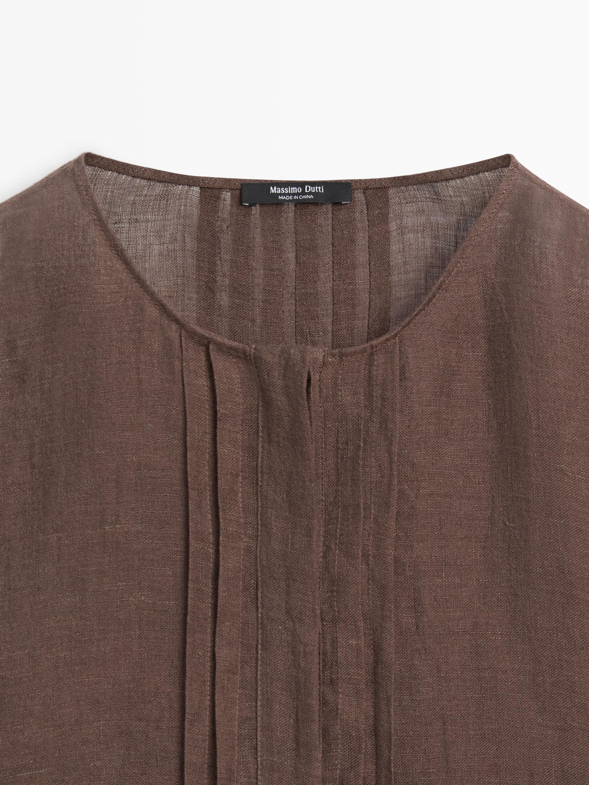 Flowing oversize linen blouse with ruffles