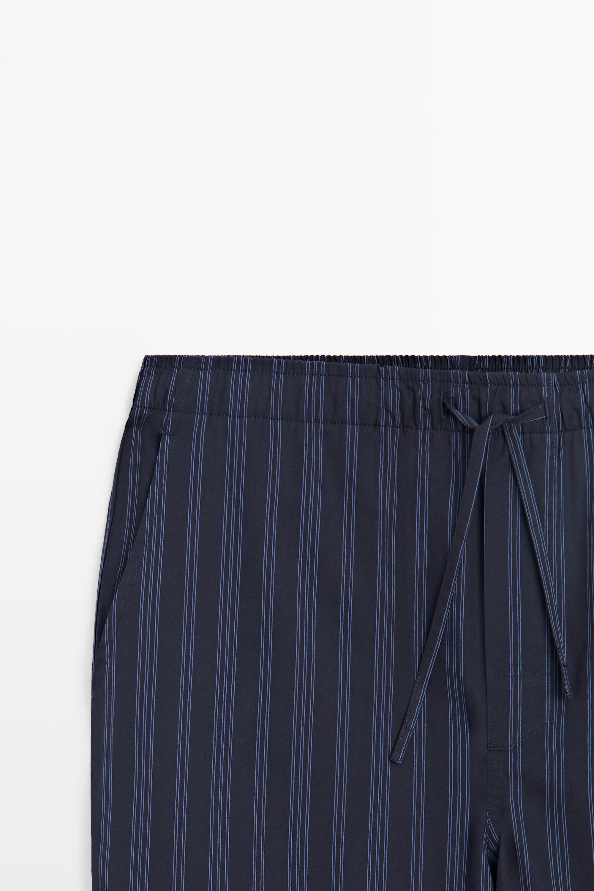 Short sleeve pyjama top and striped trousers
