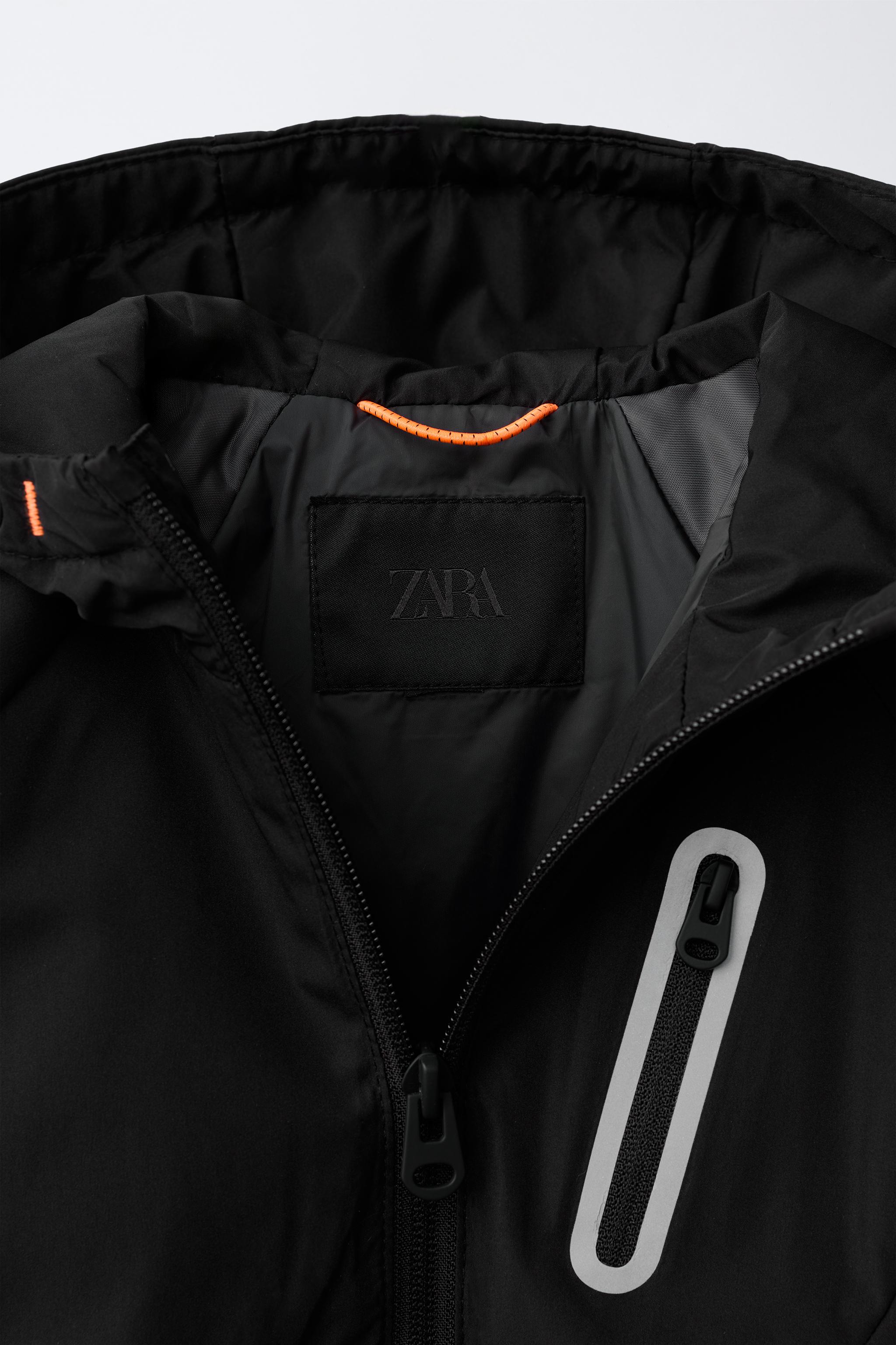 WATER REPELLENT TECHNICAL RAINCOAT