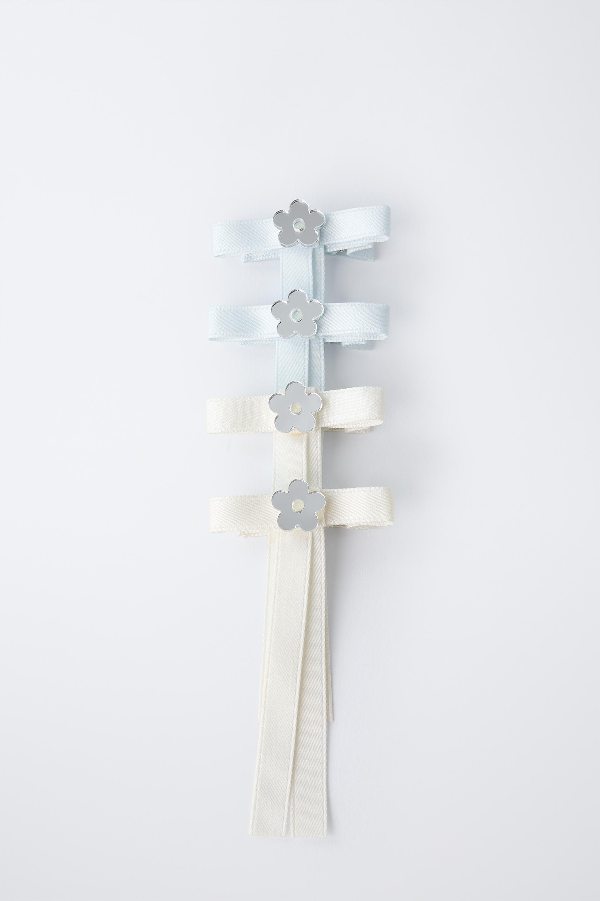 PACK OF FOUR BOW HAIR CLIPS WITH FLOWER