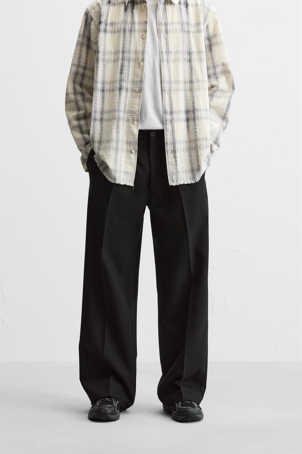 FLARED FIT PLEATED TROUSERS