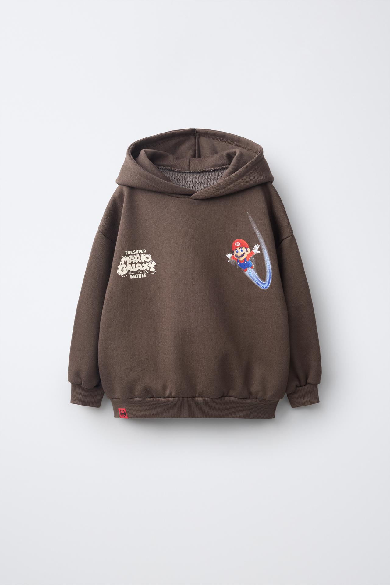 MARIO BROS. ™ © NINTENDO GRAPHIC HOODIE — Brown