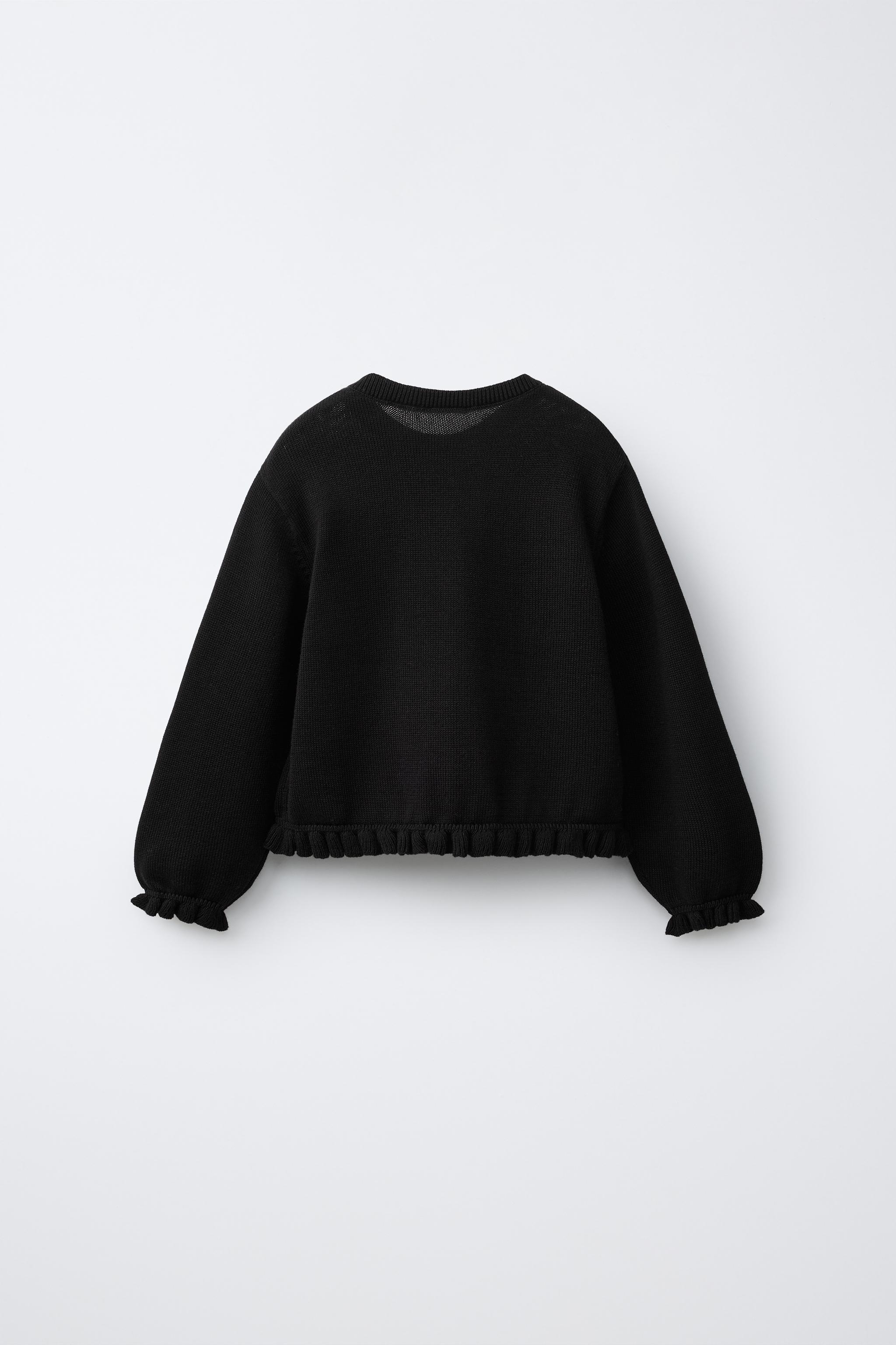 GILET EN MAILLE À PETIT VOLANT