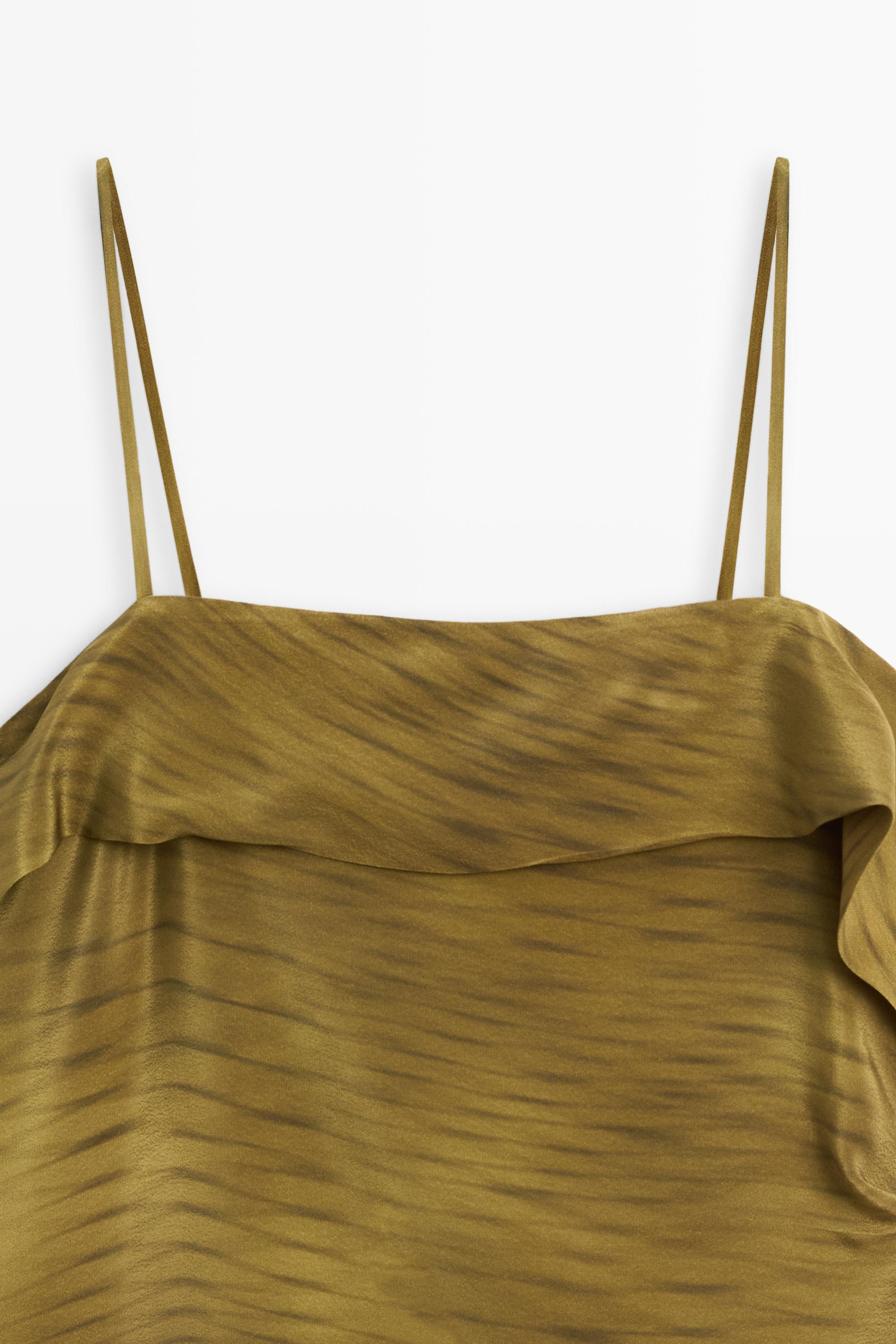 Asymmetric strappy top with draped detail