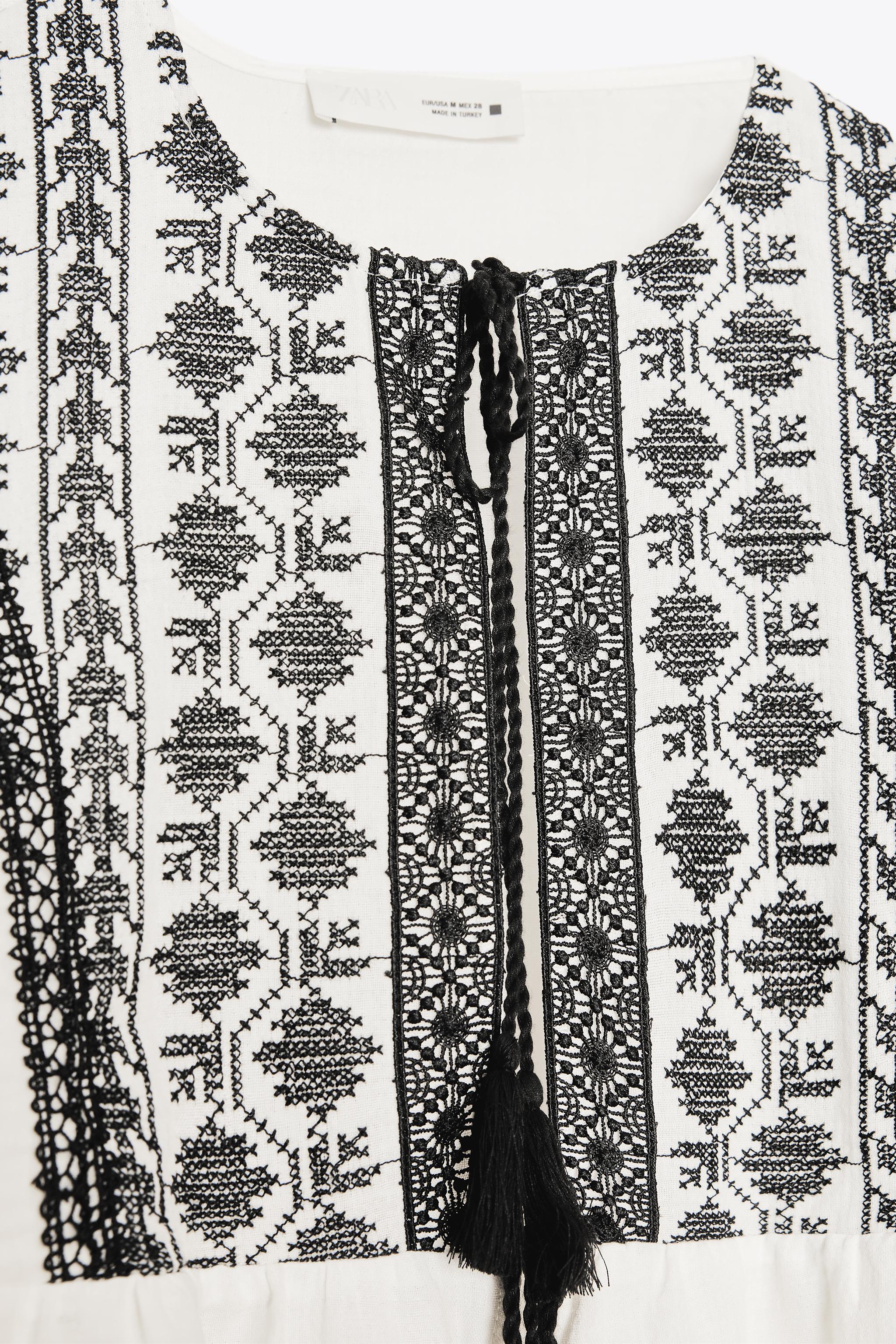 VESTE BRODERIES CONTRASTANTES