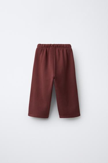 PANTALON EN MOLLETON À BANDE LATÉRALE - Grenat de Zara - Image 1