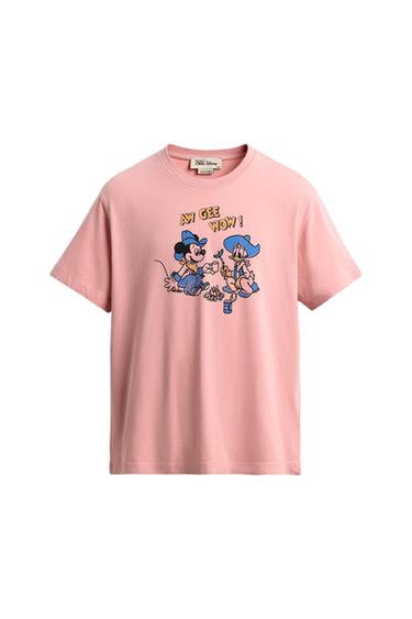Pink T-shirt with animated characters sitting print and "AW GEE WOW!" text. Neck label with Disney logo.