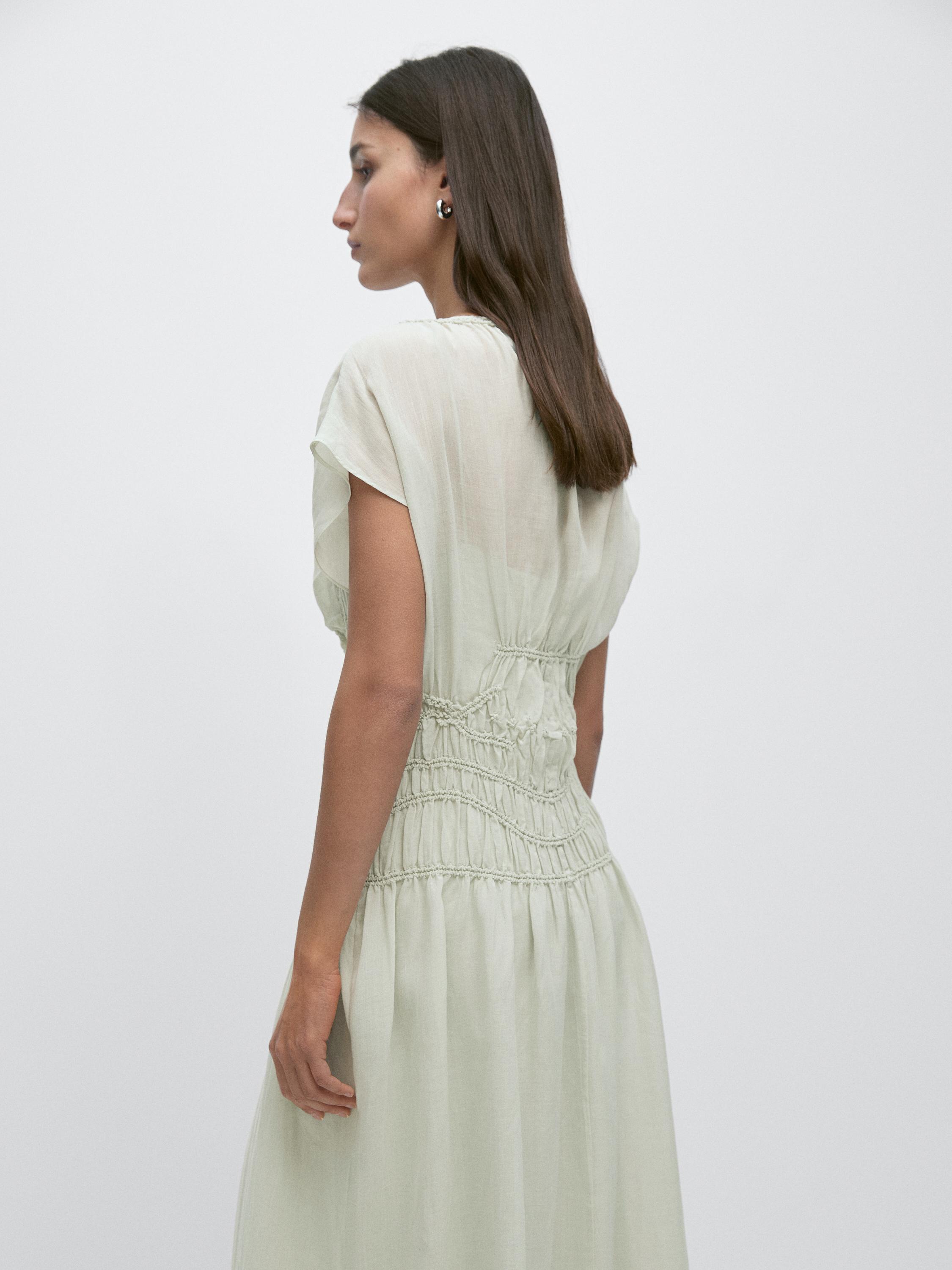 Long flowing dress with embroidered details