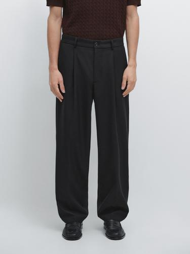 Pantalon à pinces relaxed fit en laine - Noir de Zara