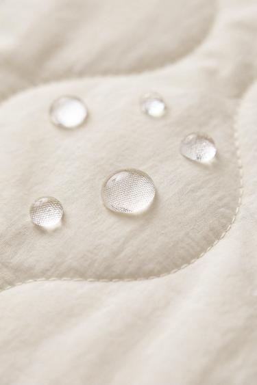 BLOUSON MATELASSÉ À LACETS - Écru de Zara - Image 9
