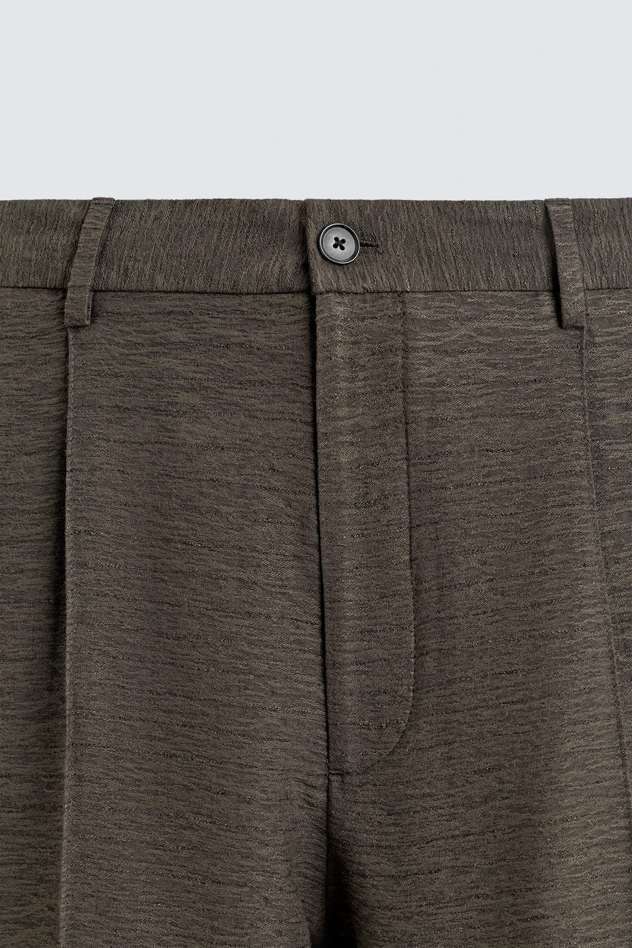 FLOWY TEXTURED PLEATED PANTS