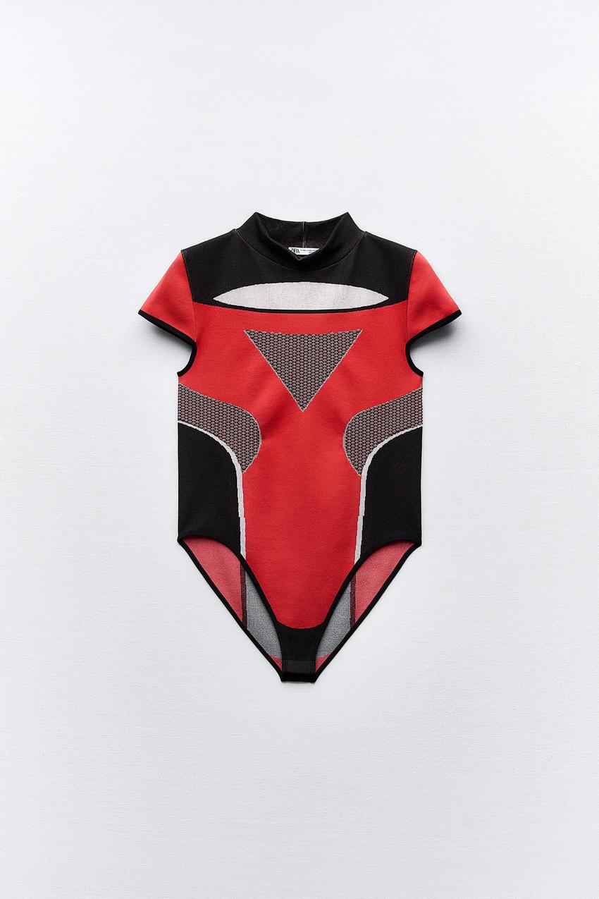 LIMITLESS CONTOUR COLLECTION<br/><br/>Fitted bodysuit with high collar and  short sleeves. Bottom snap button closure. - Red / Black