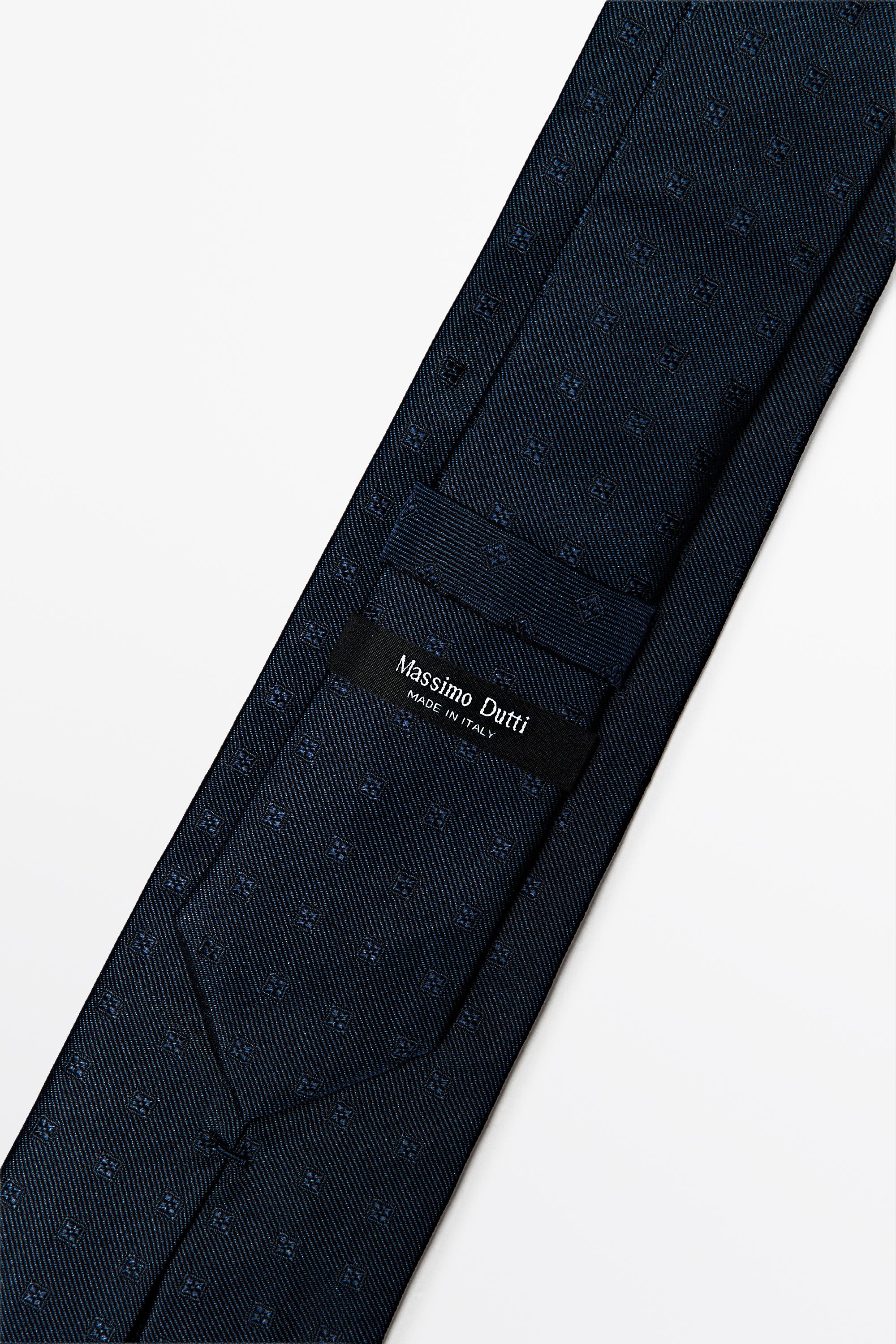 100% silk tie with embroidered detail