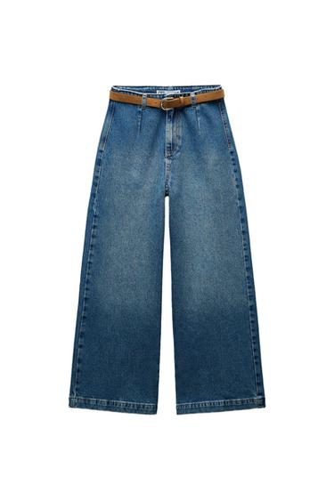 Front view of wide-leg jeans with a brown belt.