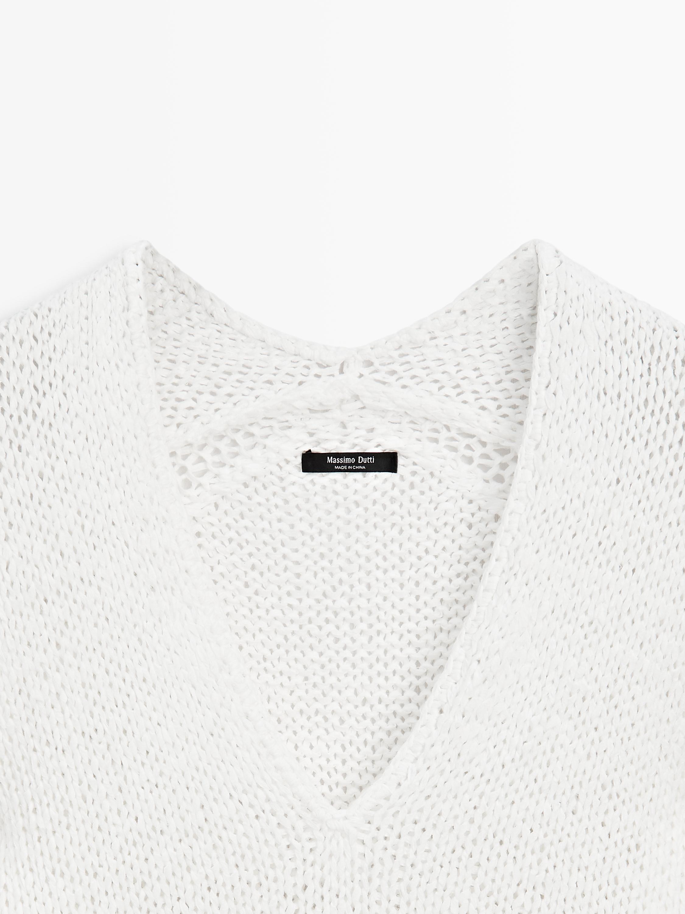 Pull en maille ajourée à col V