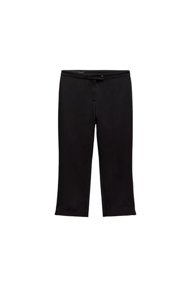 Solid black straight-cut pants with front button closure, photographed against a white background.