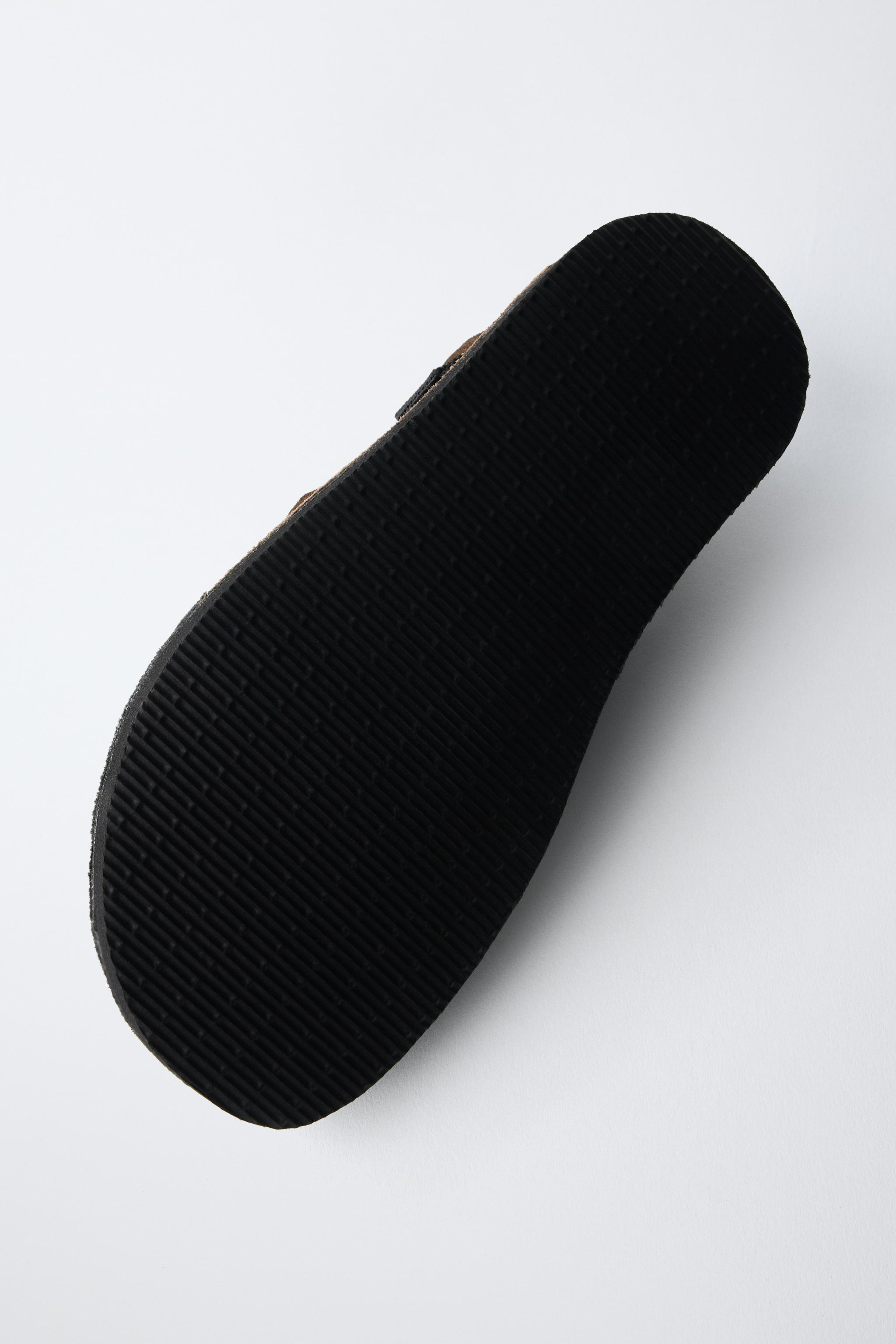 BUCKLED CLOGS