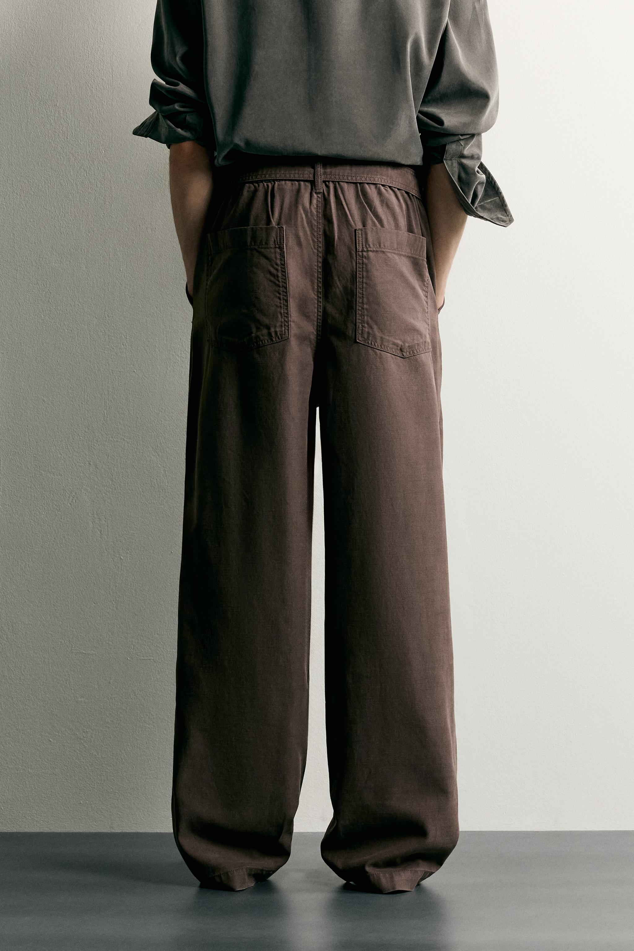 RELAXED FIT BELTED PLEATED PANTS