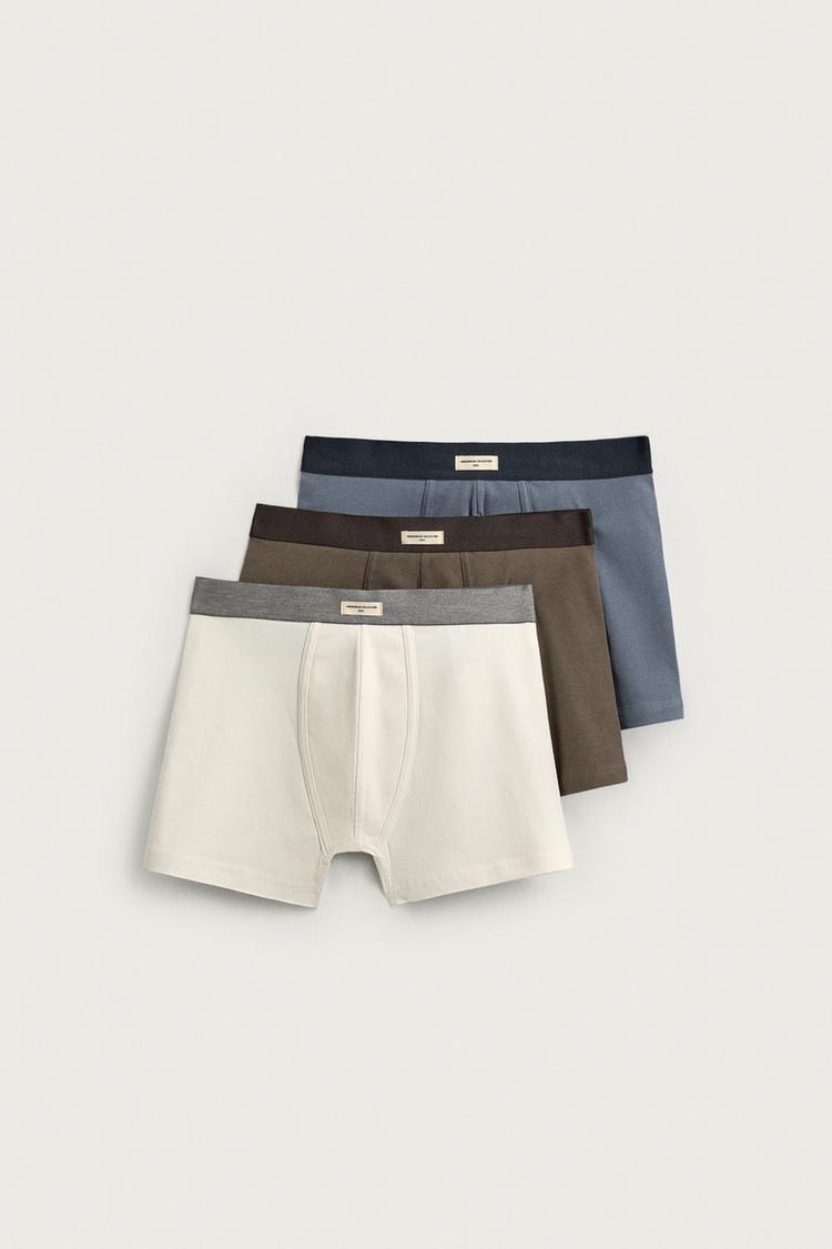 THREE-PACK OF ASSORTED BOXERS — various