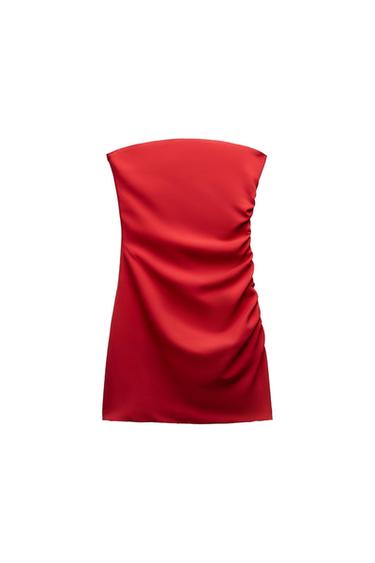 Red strapless gathered side crop top on a white background.